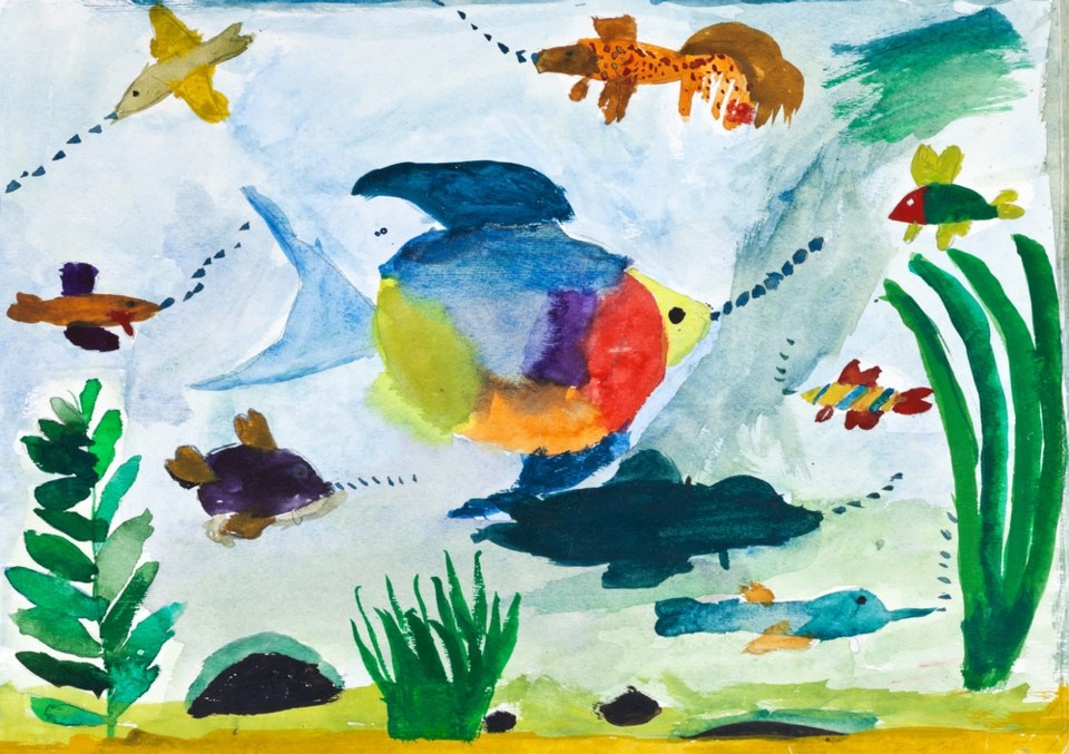 Kid's watercolor painting of the ocean with fish